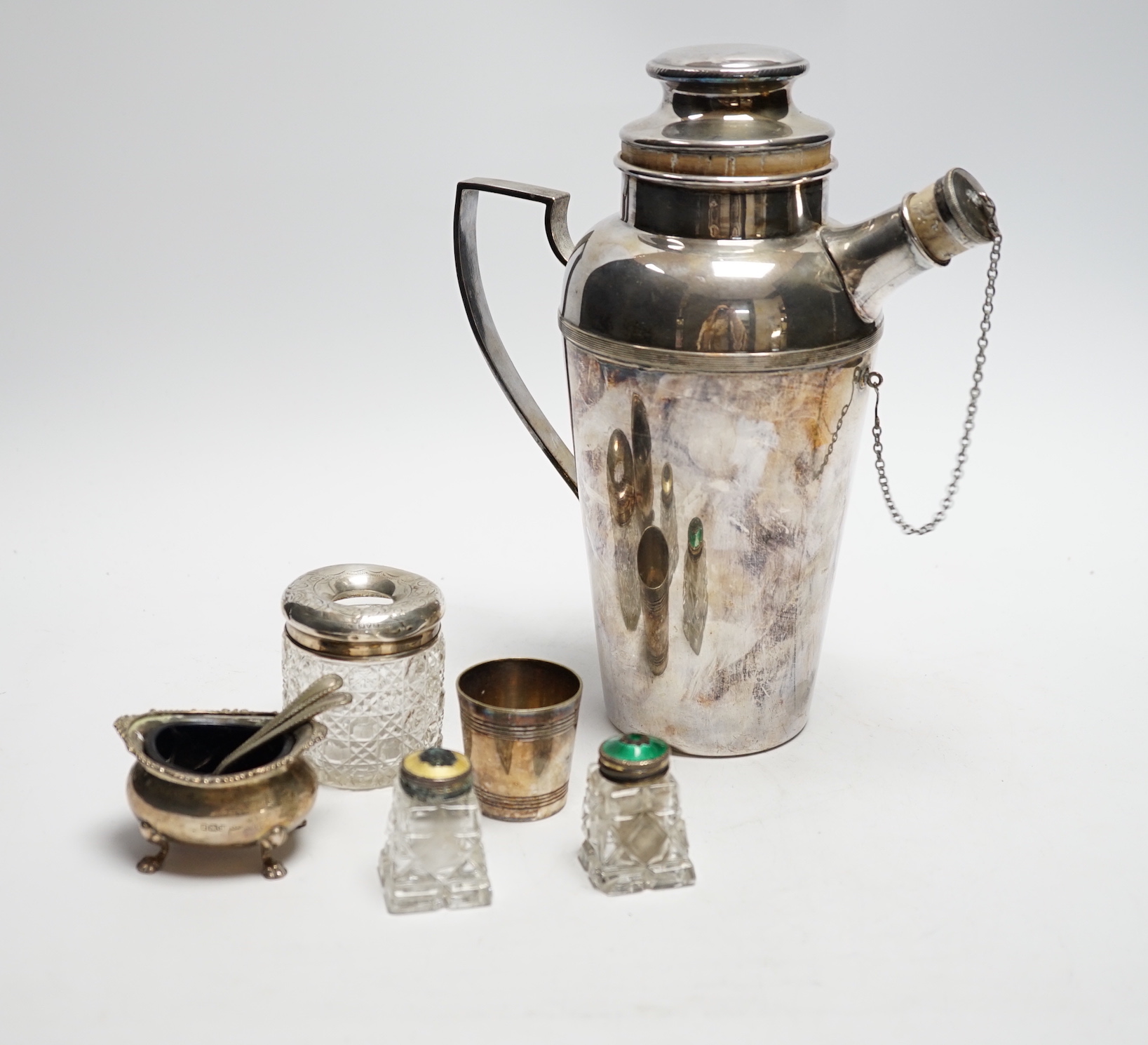 A plated cocktail shaker and sundry small silverwares including silver salt with Bristol blue glass liner, largest 23cm high